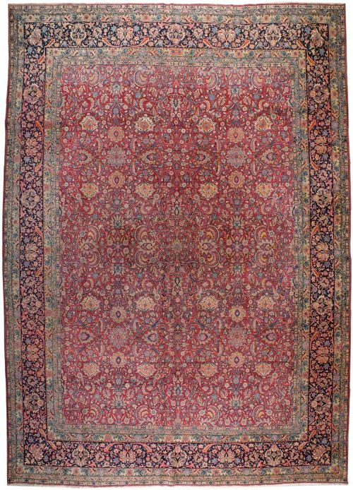 KIRMAN LAVER antique.Dusky pink ground, finely patterned with trailing flowers and palmettes in attractive colours, dark border, signs of wear, 444x296 cm.