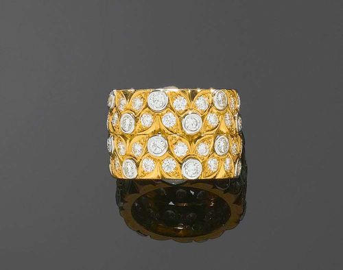 DIAMOND RING, PÉCLARD. Yellow and white gold 750. Fancy, broad band ring with stylized leaf motifs, adorned with 72 brilliant-cut diamonds totalling 4.16 ct. Size ca. 53. With copy of invoice.