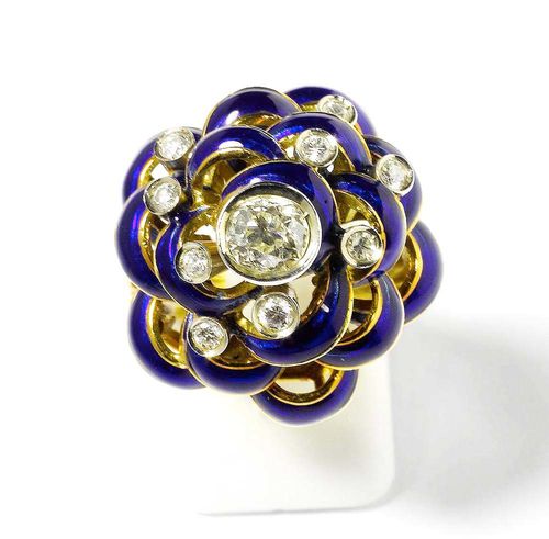 ENAMEL AND DIAMOND RING, ca. 1940. Yellow and white gold 750. Fancy model, the convex, open-worked top in the shape of a stylized flower, the centre set with 1 old-mine cut diamond of ca. 0.40 ct. The cobalt-blue petals are additionally decorated with 9 brilliant-cut diamonds totalling ca. 0.20 ct and set in white gold. Size ca. 52.
