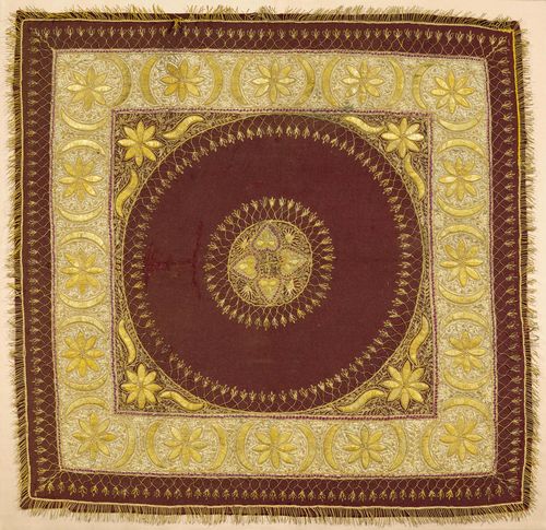 A GOLD EMBROIDERY WITH A FLORAL DESIGN ON A RED COTTON GROUND AND A BORDER OF BEIGE SILK. Turkey, early 20th c. 82x83 cm. Light restoration.