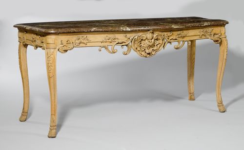 CONSOLE DE CHASSE,Regence, France, 18th century. Oak, decorated with carved leaves, flowers and rocailles. Curved faux marble top (later) , curved legs. 186x68x85 cm. Some losses. Probably formerly gilt and with marble top.