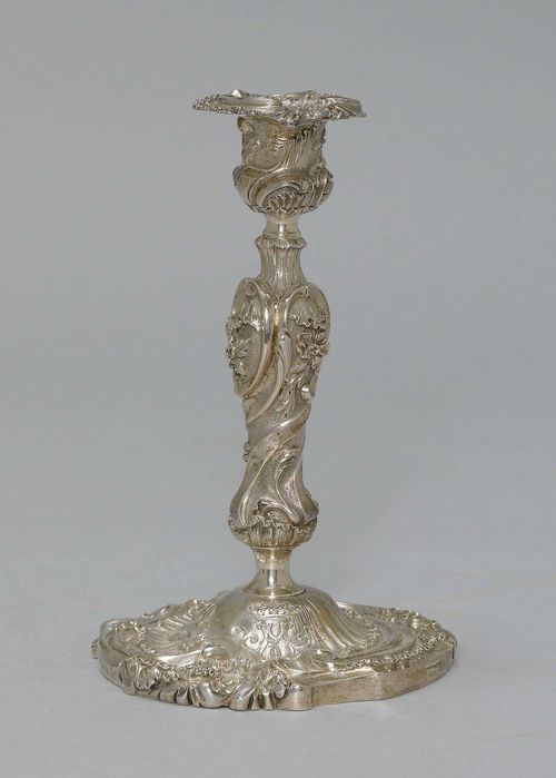 PAIR OF CANDLESTICKS,Baroque style. Bronze, silver-plated. Round shaft with profiled flower and leaf decoration, vase-shaped nozzle with protruding lip. On a flat, round base with crowned monogram "M". H 21 cm.
