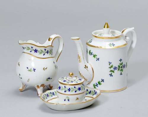 LOT OF 3 PIECES OF A SERVICE, 'FLEURS BARBEAUX', Paris, Clignancourt, ca. 1790. Painted with cornflowers and gold borders. Comprising: 1 tea pot, 1 cream jug, 1 mustard pot. Monogram mark and crowned M printed in iron- red on the cream jug and the mustard pot. Provenance: - from a private collection, Geneva.