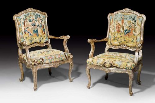 PAIR OF LARGE FAUTEUILS "A LA REINE", Louis XV style, probably Wurzburg, late 19th century. Shaped and finely carved silvered wood. With polychrome "Gros Point" covers with figural park scenes. 77x53x45x102 cm. Provenance: - L. Spik auction, Berlin 7.7.1973 (Lot No 719). - From an important German private collection.