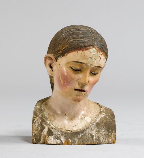 BUST OF A SAINT,Southern Italy, Naples, end of the 18th century. Wood, carved and painted. Glass eyes. H 18 cm. Fragment, probably part of a formerly dressed figure. Losses in the paint. With gilt plaster base in the Baroque style.