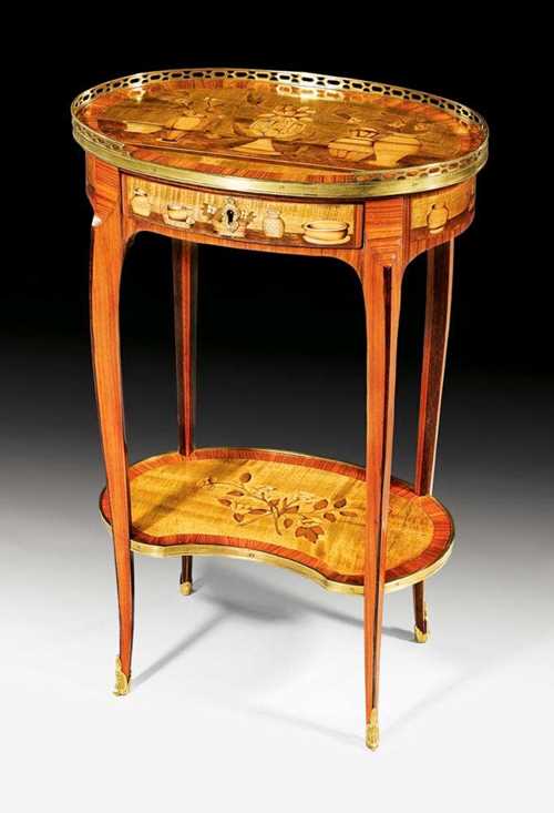 OVAL GUERIDON "AUX BOUQUETS DE FLEURS", Louis XV, stamped I. DUBOIS (Jacques Dubois, maitre 1742), guild stamp, Paris circa 1750. Tulipwood, rosewood and various precious woods in veneer and finely inlaid on all sides with vases of flowers, leaves, fillets and frieze. The top edged with a pierced brass rail. One drawer at the front. Gilt bronze mounts and sabots. Restored. 47x41x74 cm. Provenance: from a Paris collection.