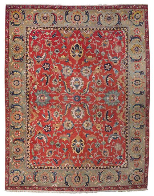 TABRIZ old.Interesting piece with a red central field, patterned throughout with large trailing flowers and palmettes in attractive colours, green border, slight wear, 430x335 cm.