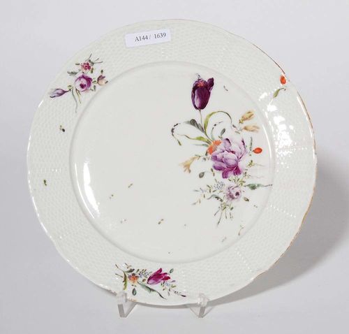 SMALL PLATE, Frankenthal, circa 1759-62.With basket weave relief and painted with large floral bouquet and smaller bouquets. Rampant lion in underglaze blue D 22cm.