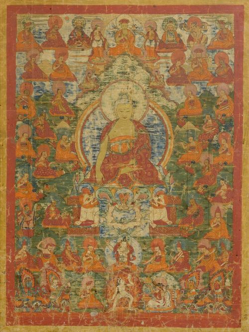 TANGKA OF SHAKYAMUNI.Tibet, 19th c. 84x59 cm. Below Buddha Shakyamuni in the center are Manjushri and a Dakini, surrounded by numerous monks and scholars of the Red Hat tradition. In a corner below are the four guardians of the world. Mounted under glass. Signs of age.