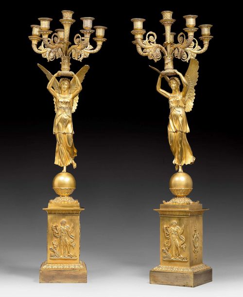 PAIR OF CANDELABRAS "AUX VICTOIRES", Empire, by P.P. THOMIRE (Pierre Philippe Thomire, 1759-1843), Paris circa 1810. Matte and polished gilt bronze. H 83 cm. Provenance: - From a very important German private collection.