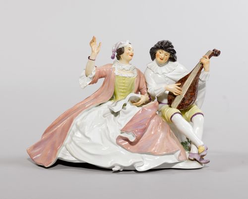 GROUP OF FIGURES "SCARAMOUCHE" AND "COLUMBINE",Meissen, ca. 1929. Both figures sitting next to one another on a rock and playing musical instruments. Scaramouche wearing a black cap and playing the lute, Columbine singing from a book of music on her lap. Underglaze jubilee mark on the occasion of the "Millennium", sword mark with dot and 1929, underglaze blue sword mark with incisions for second quality on the back of the base. Model number 250 incised. H 18 cm, L 28 cm.