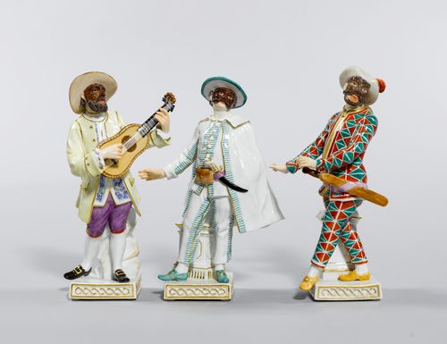 GROUP OF 3 COMEDY FIGURES,Meissen, after 1934. Each on a square base accentuated with gold.  Brighella (Mod. 64650), Harlequin (Mod. 64564), Boaro (64566), Underglaze blue sword marks. (3)