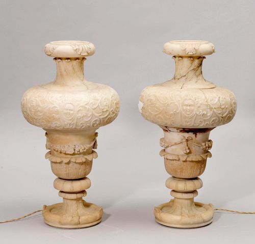 PAIR OF ALABASTER VESSELS AS LAMPS, Art Nouveau and later. Retracted foot. The walls decorated with leaves. D 35 cm, H without lampshade 70 cm. Partly repaired.