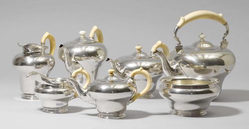 COFFEE AND TEA SERVICE,Austria, 1850. Manufactory: Franz Schiffer. Comprising: water kettle, coffee pot, two tea pots, water jug, cream jug, biscuit tray. Rechaud missing. Bone handles and finials, the finials of the coffee pot and the water kettle not original. H of the coffee pot ca. 23 cm, total weight 4740 g.