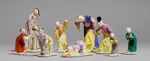 9 CHINESE FIGURES FROM A PAGODA SET,Nymphenburg, model by Franz Anton Bustelli, 20th century. Comprising: 2  similar Chinese children at worship (press numbers 67II/27 and 67/0, H 10 cm), 1 smaller Chinese child at worship (press number 8, H 8 cm), 1 Chinese man playing the horn (press number 489, H 14 cm), 1 Chinese man kneeling and bowing (incised number 28, L 14 cm), 1 kneeling Chinese woman (press number 182/0, H 11 cm), 1 bowing Chinese man (press number 134/0, H 14.5 cm), 1 Chinese man playing the lute (press number 288/33, H 17 cm), 1 small Chinese dancing (press number 287/3, H 12.5 cm). Impressed shield mark on the bottom and accentuated with gold and blue on the top. (9)