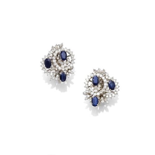 SAPPHIRE AND DIAMOND CLIP EARRINGS, ca. 1980. Yellow gold 750 Each set with 3 oval sapphires, weighing ca. 3.00 ct in total, and set throughout with single-cut diamonds, weighing ca. 1.50 ct in total.