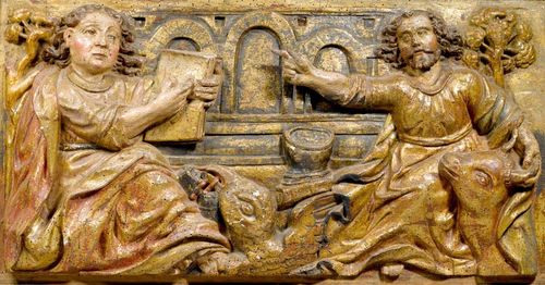 PAIR OF RELIEFS,Spain, late 16th century. Relief carved and painted walnut. Each depicting one of the Evangelists with their attributes. Each 34x68.5 cm.