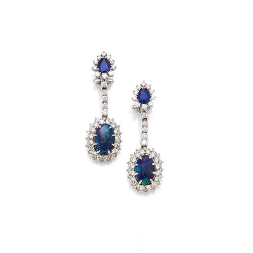 BLACK OPAL, SAPPHIRE AND DIAMOND EARRINGS. White gold 750. Each set with 1 black opal cabochon of ca. 11 x 8 mm and 1 pear-cut sapphire, within a border of diamonds. Total weight of the sapphires ca. 1.00 ct and total weight of diamonds ca. 1.80 ct. L ca. 4.5 cm.