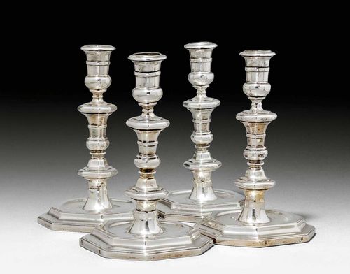 4 CANDLESTICKS, probably 19th century. Stepped, octagonal base. Engraved, crowned coat-of-arms. Octagonal shaft with vase-shaped nozzle. H 19 cm, total weight: 2748 g. Provenance: From a German private collection.