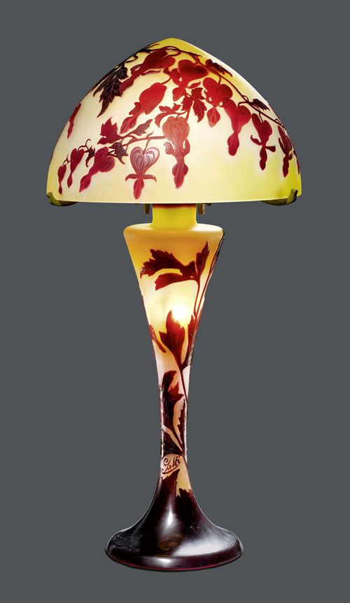 EMILE GALLE TABLE LAMP, circa 1900 Yellow glass with pink and red overlay and etching. Mushroom-shaped lamp, decorated with bleeding hearts. Signed Gall&#233;. H 58 cm.