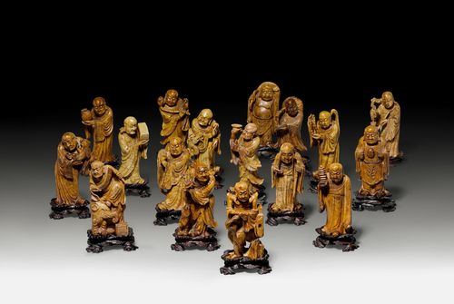 17 CARVED SOAPSTONE FIGURES OF LUOHANS. China, 19th c. Height ca. 13 cm. Beige-brown soapstone with engraved decoration. Wooden bases. Minor chipping. (17)
