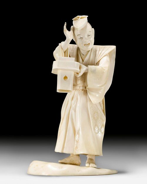 AN IVORY OKIMONO OF A KYÔGEN FIGURE. Japan, Meiji Period, Height 11.5 cm. (wooden body).