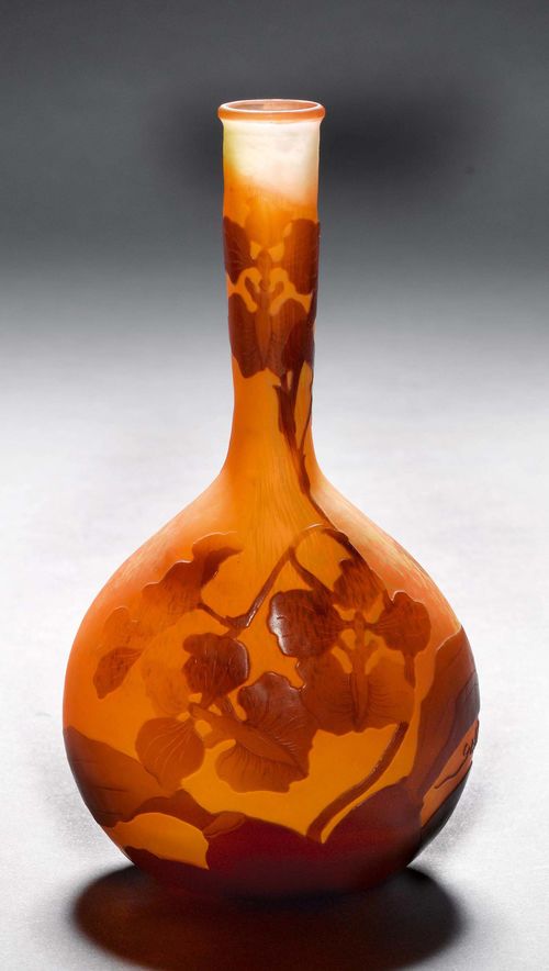 EMILE GALLE VASE, ca. 1900. Orange glass with brown overlay and etching. Drop-shaped vase, decorated with orchids. Signed Gallé. H 15.5 cm.