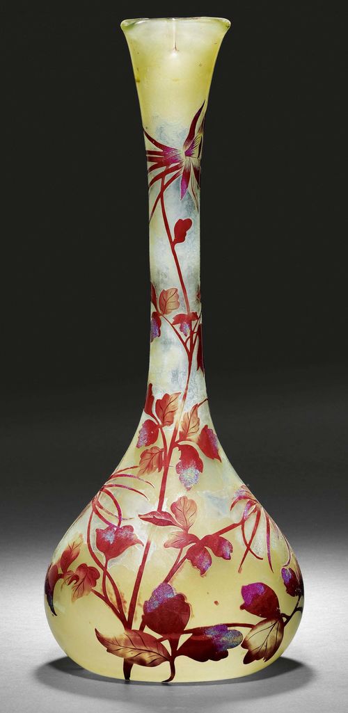 EMILE GALLE VASE, ca. 1904. Yellow glass with red overlay, etched and fire-polished. Drop-shaped vase, decorated with lilies. Signed Gallé with star. H 51 cm.