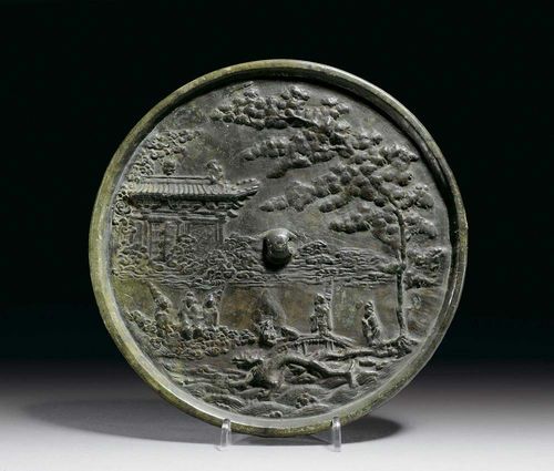 LARGE BRONZE MIRROR with relief decoration showing Emperor Xuangong's journey to the moon. China, Northern Song Dynasty, 12th century. D 21.2 cm. Cf. Rose Kerr, Later Chinese Bronzes, 1990, Ill. 76, p. 94.