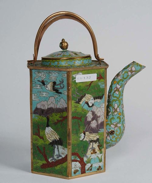 HEXAGONAL TEAPOT. Cloisonné enamel with a double handle. On each side, a pair of cranes in a landscape. The lid and the spout have a floral motive on a turquoise background. China, 19th century. H 19 cm.
