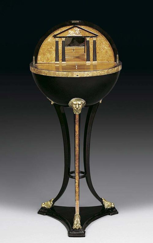 GLOBE TABLE, Biedermeier, Vienna circa 1815/20. Cherry, beech and burlwood, partly ebonised. Hinged globe on three lion supports, the architectural  style interior with removable mirrored compartment, flanked by pilasters, the top lined inside with mirror, with 3 compartments as removable drawer over 3 secret compartments and drawer. D 45 cm, H 102 cm. Provenance: Castle collection, South Germany