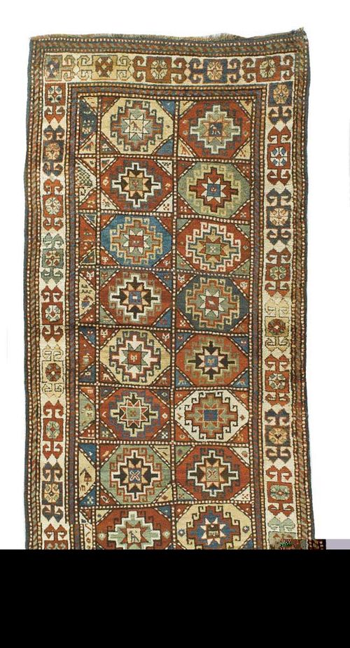KAZAK old. Central field divided into squares with star motifs, light border. Good condition.260x120 cm.