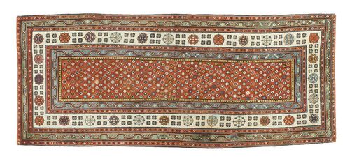 TALISH old. Red central field with small star motifs, border in white, blue, red and green with stylised flowers. The fringes missing and with small worn areas, restored, otherwise good condition. 270x108 cm.
