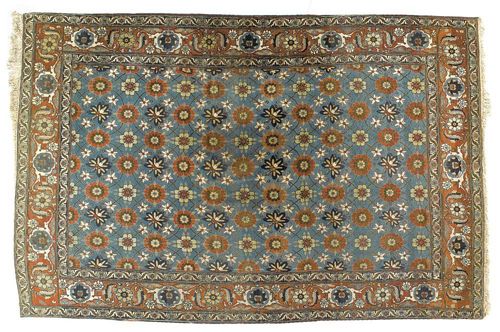 VERAMIN antique. Light blue central field patterned with fine flowers in red and blue, with red border. Some wear. 315x205 cm.