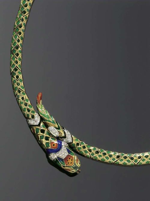 ENAMEL, DIAMOND AND GOLD NECKLACE. Yellow gold 750. Decorative necklace, in the shape of a snake with a blue-green enameled body. Head and tail are additionally adorned with 35 brilliant-cut diamonds, totaling ca. 0.20 ct. L ca. 41.5 cm.
