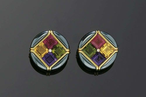 GEMSTONE AND HAEMATITE CLIP EARRINGS, BULGARI. Yellow gold 750. With 4 cut haematite pieces, the center set with 4 gemstone carrés: tourmaline, amethyst and citrine totaling 46.00 ct and 2 additional small brilliant-cut diamonds. Signed Bulgari C2464. With case and copy of insurance estimate.
