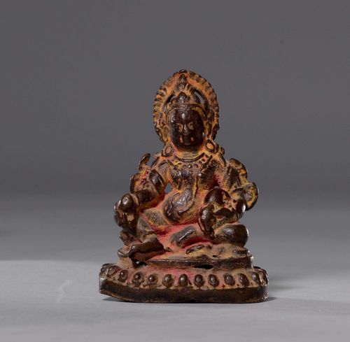 A SMALL BRONZE FIGURE OF JAMBHALA WITH TRACES OF RED OFFERING POWDER.