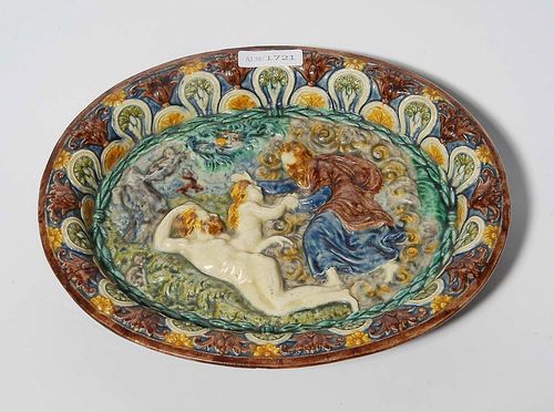 OVAL RELIEF-DECORATED BOWL, France, 19th century. In the style of Palissy with mythological motifs. Painted in green and shaded brown. D 24cm.