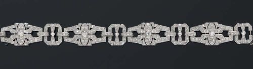 DIAMOND BRACELET, Art Déco, France, ca. 1930. Platinum. Elegant bracelet. The open-worked, geometric links are set with ca. 248 old-mine-cut and octagonal diamonds totalling ca. 5.00 ct. L ca. 18 cm.
