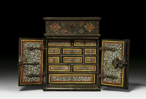 MINIATURE CABINET WITH WISMUT-PAINTING, Baroque, probably South German, 17th century Wood painted on all sides with bright flowers and leaves on black ground. With salient hinged top on shaped plinth. Double door front and fitted interior with 11 drawers, 2 compartments, one with top. Fine iron lock. 24x18x31 cm. Provenance: Private collection, Basel.