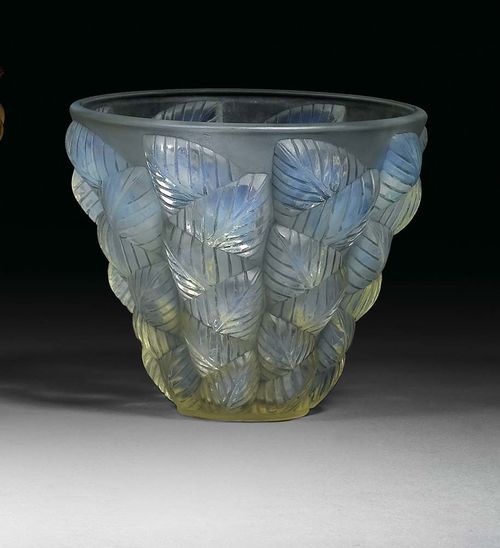 VASE "Moissac", R. Lalique, ca. 1930. Colourless glass with blue iridescence, mould pressed with stylised leaves, base signed R. Lalique France, H. 13.5 cm