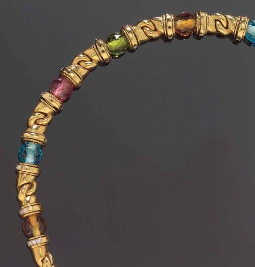 GEMSTONE AND DIAMOND NECKLACE, BULGARI. Yellow gold 750, 140g. Doppio Gancio model, designed as intertwining hooks, set with 12 facetted gemstone beads, such as topazes, citrines, tourmalines, etc. totalling ca. 85 ct, flanked by diamond roundels totalling 4.77 ct. L 40 cm. En suite to following lot.