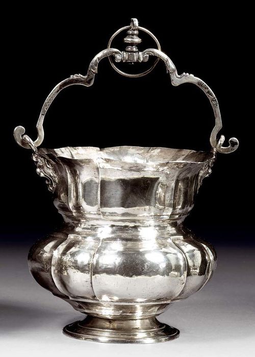INCENSE BURNER. Naples, 1766.Simple pan with wide longitudinal folds. With masks as the base of the curved handle with applied acanthus on both sides. 13x12.5 cm. 340 g. Minor repair. Formerly part of the Bulgari Collection.