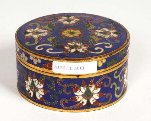ROUND CONTAINER WITH LID with  cloisonné decoration on a dark-blue background. Lotus petals, on the side of the lid floral band. Turquoise bottom and interior. China, 1st half of the 19th century. D 9.2 cm. Slightly damaged. Berti Aschmann Collection.
