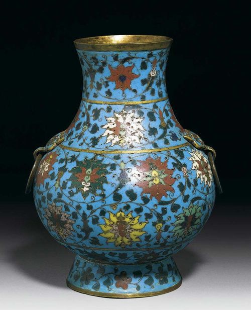 HU-TYPE VASE with flat lion head applications and ring-shaped handles on the shoulder. Turquoise cloisonné enamel background with classical Ming-style lotus tendrils. Gilding residue, gilded base. China, 19th century. H 27 cm. Berti Aschmann Collection.  Cf. Brinker/Lutz, Chinese Cloisonné - the Pierre Uldry Collection, 1985, Ill. 351.