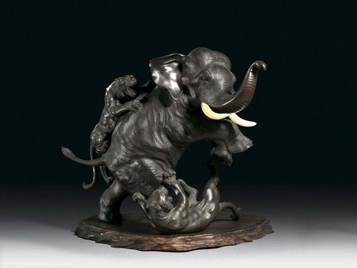 DRAMATIC BRONZE GROUP. An elephant is desperately defending itself against the attack of two tigers. Whereas one of the tigers has already been wrestled to the ground, the other one has dug its claws into the elephant's back. Dark bronze, ivory tusks. Signed: Seiya shû. Wooden stand. Japan, Meiji Period, H 33 cm.