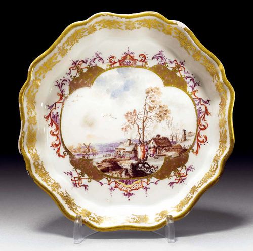 SWEET DISH WITH WINTER SCENE, Meissen, circa 1723-24.Depicting a Dutch winter scene with figures and skaters, set in gold cartouche with Böttgerlüster,in iron red and purple, with miniature Chinese motifs in purple. Gilt edge. Overglaze sword mark in blue, Gold mark T. D 14.5cm. Provenance: from a private collection, Solothurn