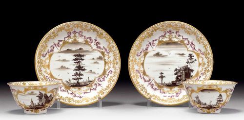 PAIR OF CUPS AND SAUCERS WITH SCHWARZLOTMALEREI, Meissen, circa 1723-25.Fine river landscapes with buildings and figures in cartouches with gold decoration and Böttger luster, heightened with purple foliate decoration. With a spray of Indianischer Blumen in Purpur Camaïeu. The underside of the saucers with iron red ring border. No marks. Gold numbers 32., Potter's mark. The gilding slightly rubbed. Provenance: from a private collection, Solothurn