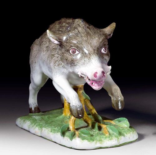 LEAPING WILD BOAR, Strassburg, Paul Hannong period, circa 1750-54.Model by J.W. Lanz. Naturalistically modelled and painted in muffle kiln colours. No mark. L 21 cm, H 12.5cm. Old restoration on the left front foot, both ears and the leaves, one tooth broken. Provenance: from an important private collection, Basel