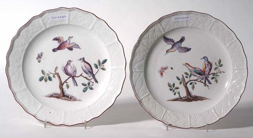 PAIR OF PLATES WITH HAUSMALER DECORATION, Meissen, mid 18th century 'Alter Ausschnitt', with Sulkowski relief decoration, each painted with a pair of birds on a branch and a bird in flight. Underglaze blue sword mark, impressed number 19 on one plate. D 23cm. Provenance: from a private collection, Solothurn